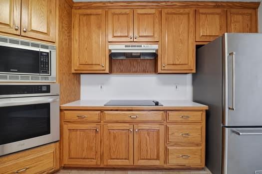 1828 4 Mile Church Road Ball Ground, GA 30107 - Photo 19 of 46 a kitchen with granite countertop cabinets and steel stainless steel appliances