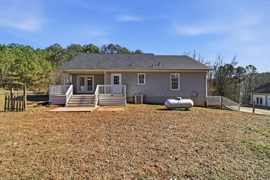 1828 4 Mile Church Road Ball Ground, GA 30107 - Photo 23 of 46 a house view with a backyard space