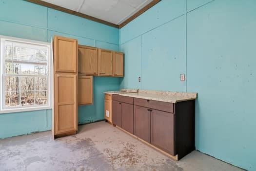 1828 4 Mile Church Road Ball Ground, GA 30107 - Photo 29 of 46 a kitchen with a refrigerator and a sink