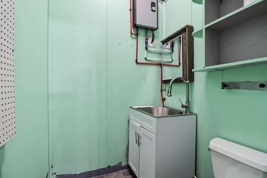 1828 4 Mile Church Road Ball Ground, GA 30107 - Photo 30 of 46 a bathroom with a toilet sink and mirror
