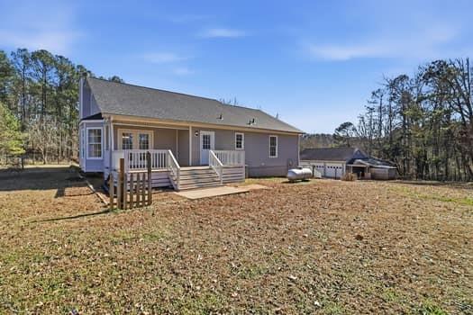 1828 4 Mile Church Road Ball Ground, GA 30107 - Photo 3 of 46 front view of a house with a yard