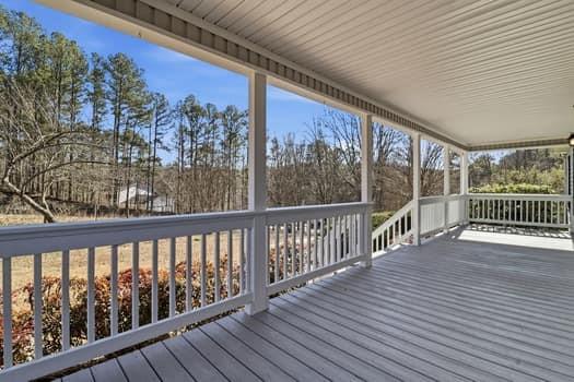 1828 4 Mile Church Road Ball Ground, GA 30107 - Photo 5 of 46 a view of a balcony with wooden floor