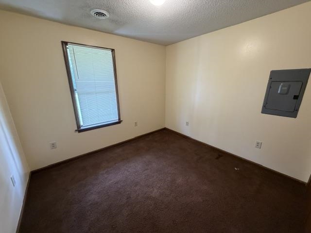 9450 Holly Grove Road Brighton, TN 38011 - Photo 10 of 10 Interior room featuring light-colored walls and brown carpet flooring