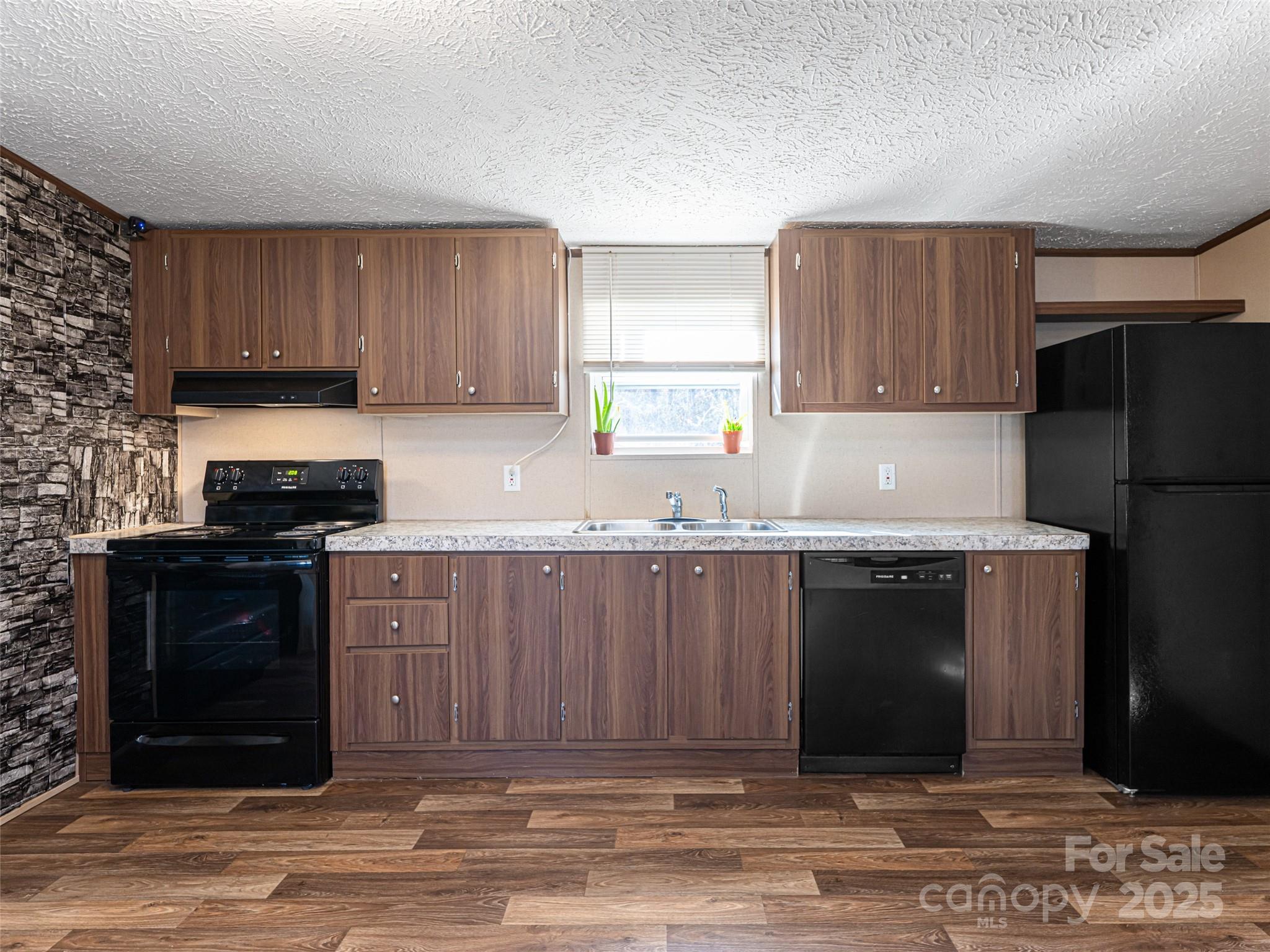 4148 Tallent Road Morganton, NC 28655 - Photo 15 of 30 a kitchen with granite countertop a refrigerator stove and oven
