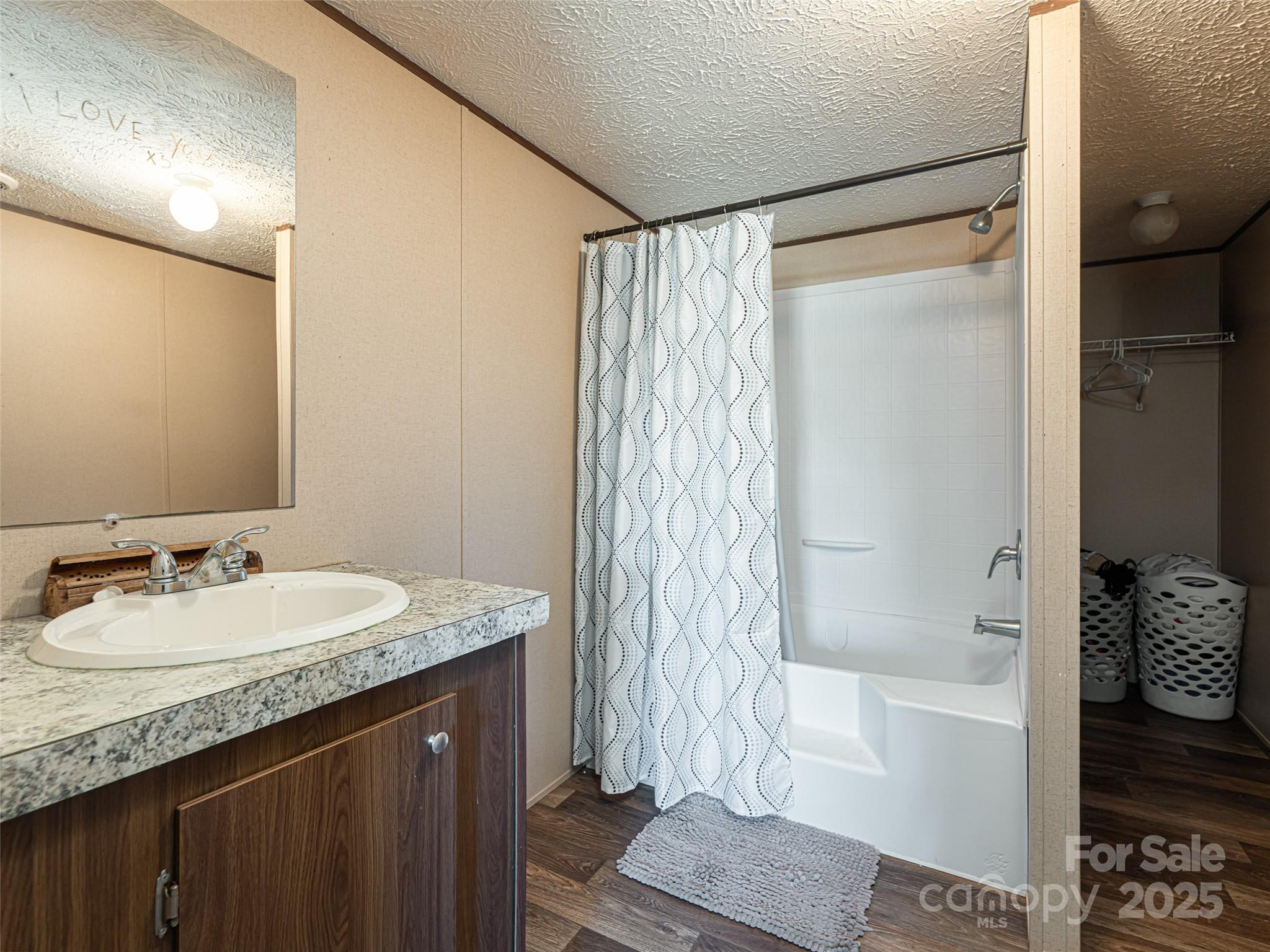 4148 Tallent Road Morganton, NC 28655 - Photo 18 of 30 a bathroom with a granite countertop sink and a mirror