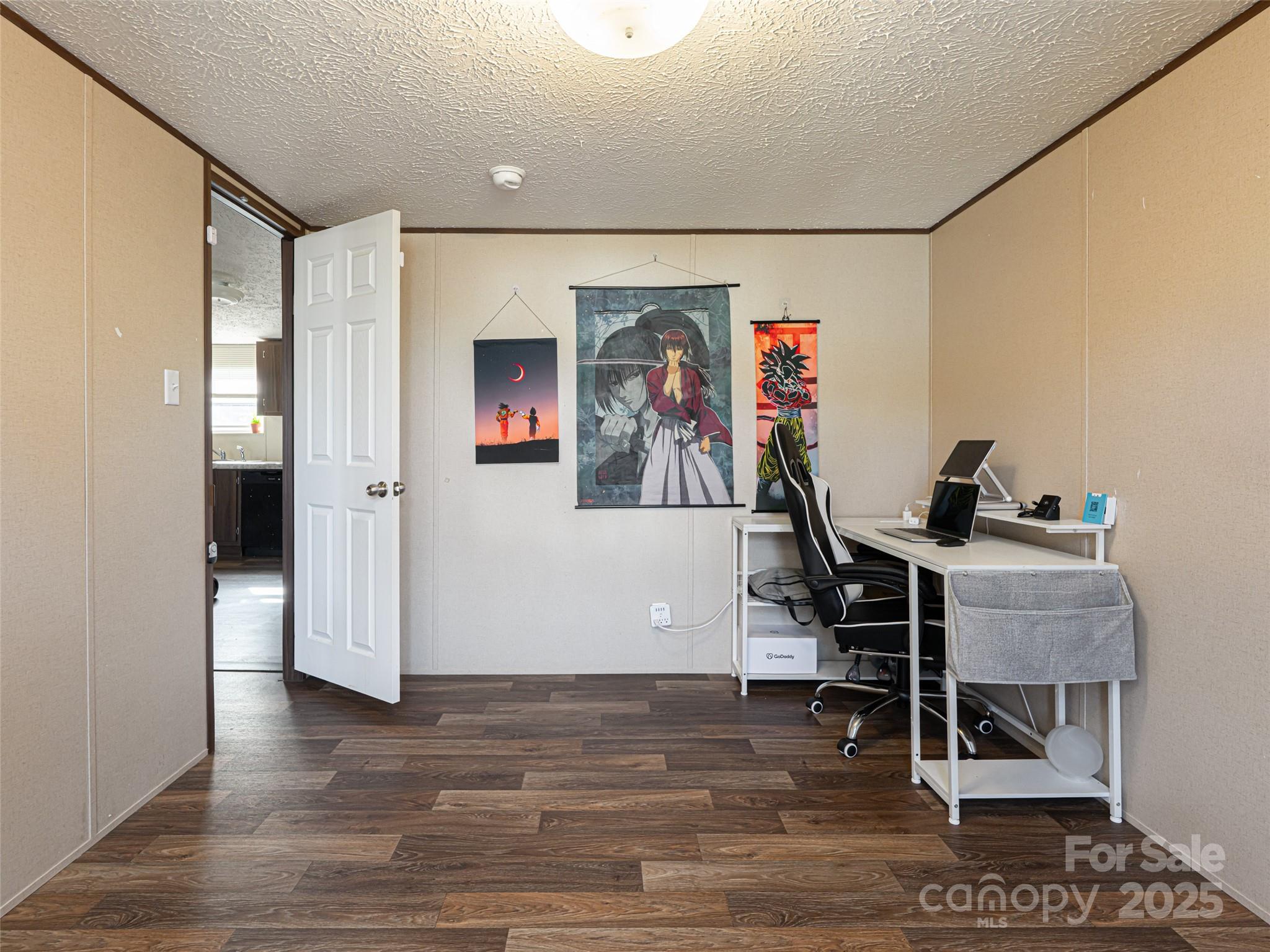 4148 Tallent Road Morganton, NC 28655 - Photo 22 of 30 a workspace with wooden floor and furniture
