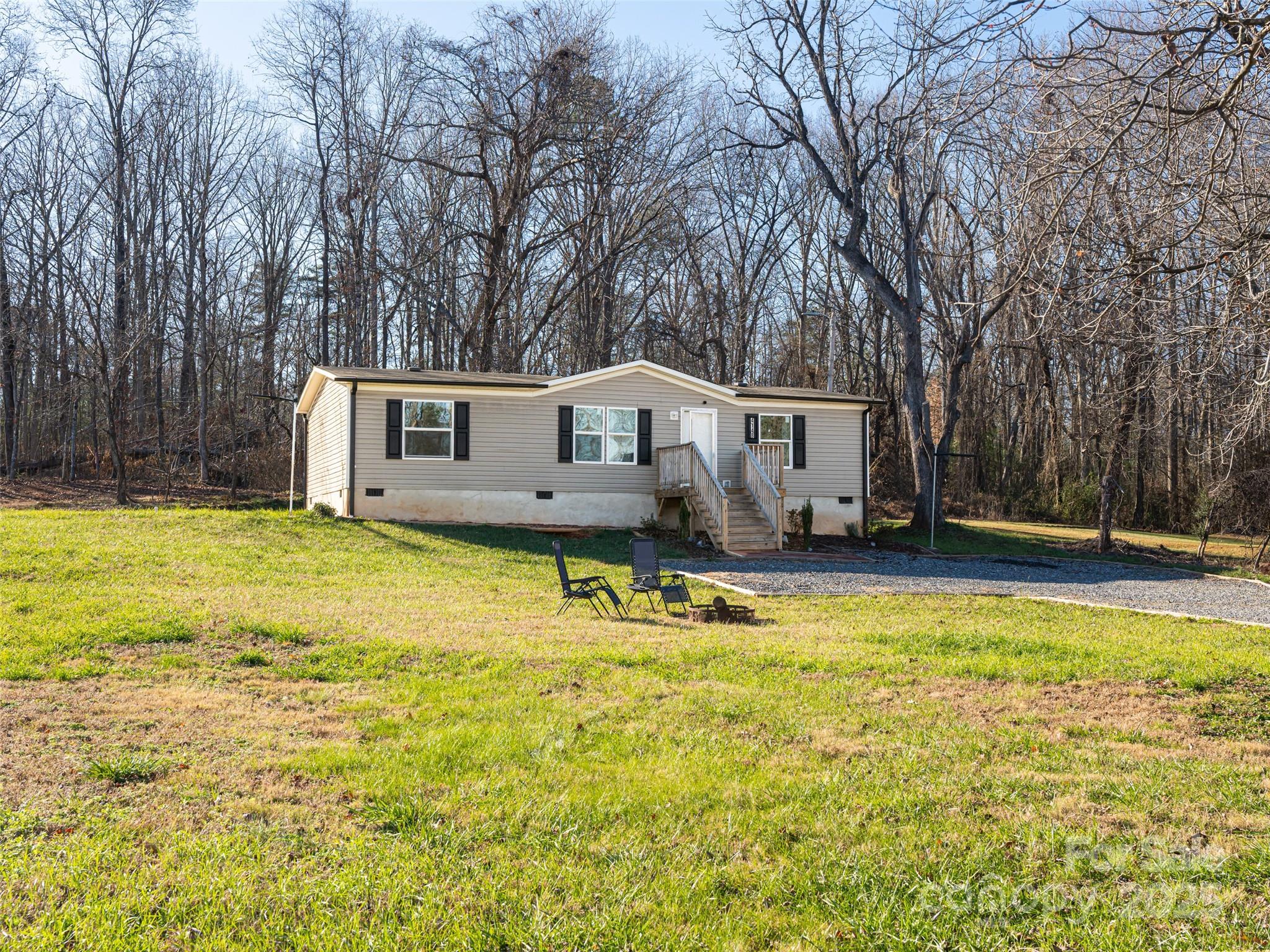 4148 Tallent Road Morganton, NC 28655 - Photo 29 of 30 a view of a house with swimming pool and sitting area