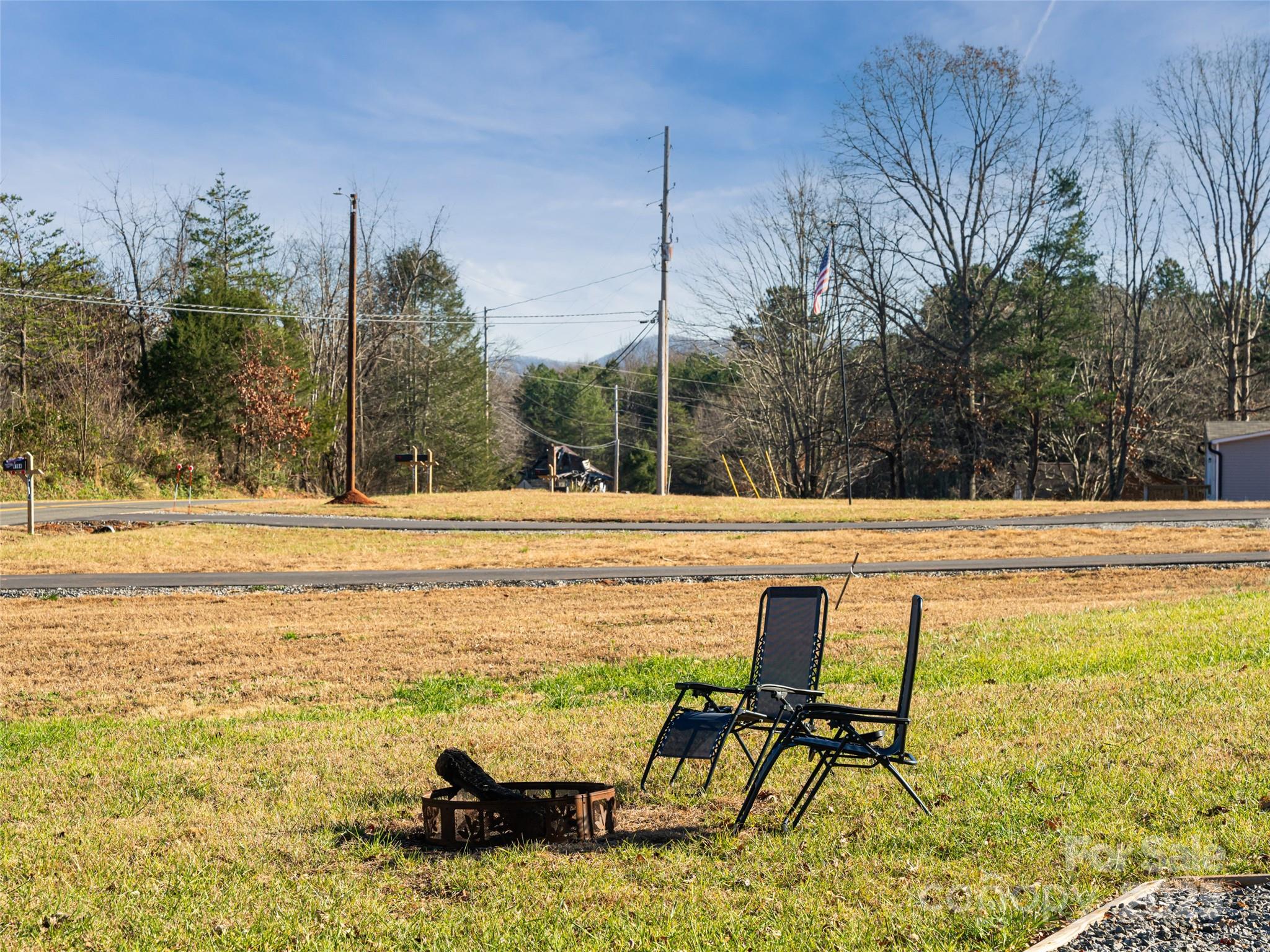 4148 Tallent Road Morganton, NC 28655 - Photo 30 of 30 a view of a swimming pool with lawn chairs and wooden fence