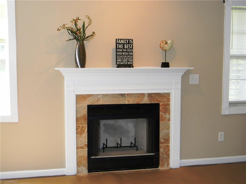 4680 Hampton Road Clemmons, NC 27012 - Photo 23 of 27 Marble Surround and Fluted Moldings on Mantel enhance Wood Burning Fireplace with Blower. (Fireplace never used)