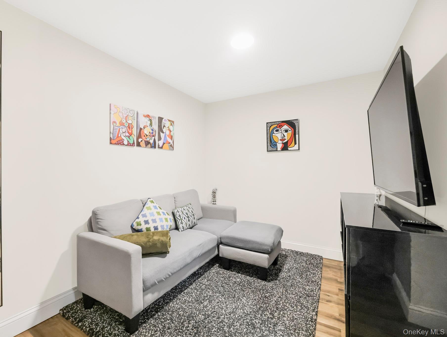 248 Rockne Road Yonkers, NY 10701 - Photo 11 of 40 Living area with light wood finished floors and baseboards