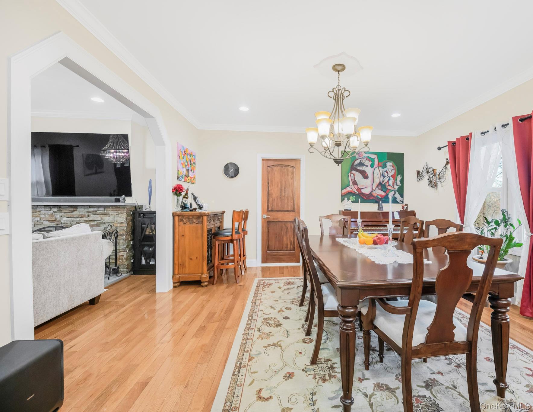 248 Rockne Road Yonkers, NY 10701 - Photo 28 of 40 Dining room featuring light wood-style flooring, crown molding, a chandelier, and recessed lighting