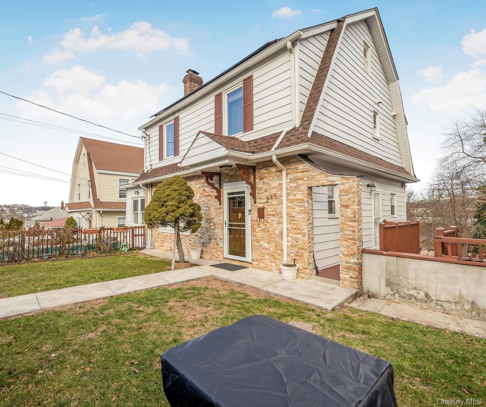 248 Rockne Road Yonkers, NY 10701 - Photo 3 of 40 View of front of house with a gambrel roof, roof with shingles, a chimney, and brick siding