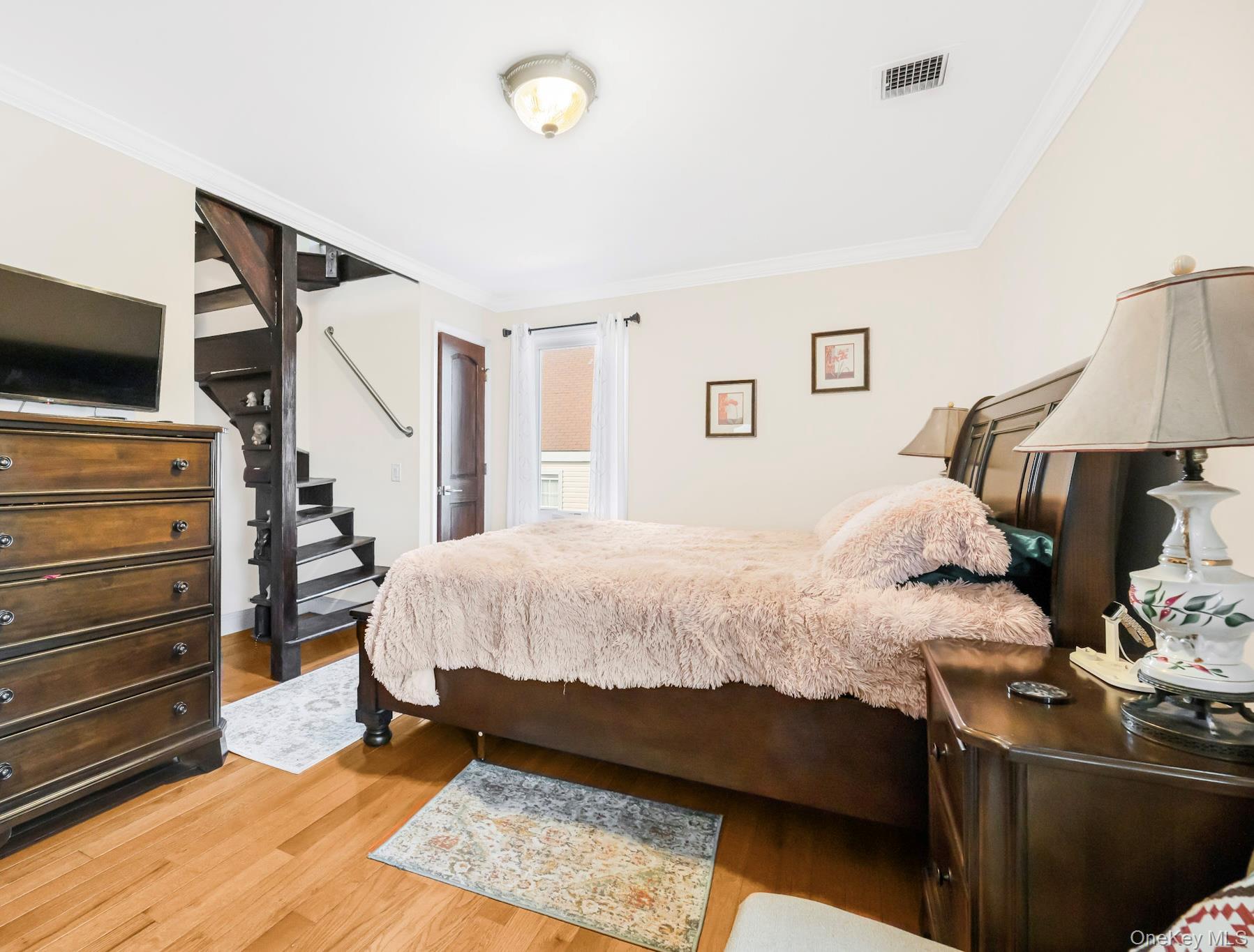 248 Rockne Road Yonkers, NY 10701 - Photo 34 of 40 Bedroom featuring ornamental molding and light wood finished floors