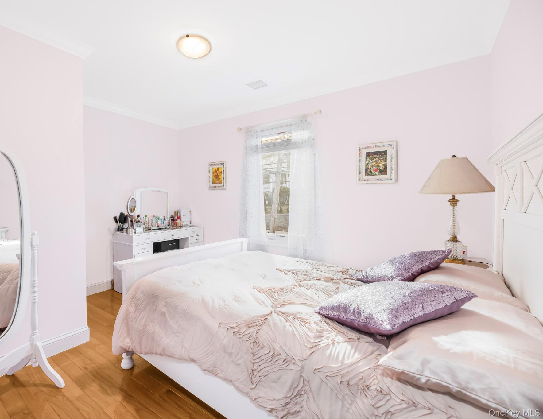 248 Rockne Road Yonkers, NY 10701 - Photo 36 of 40 Bedroom featuring wood finished floors and crown molding
