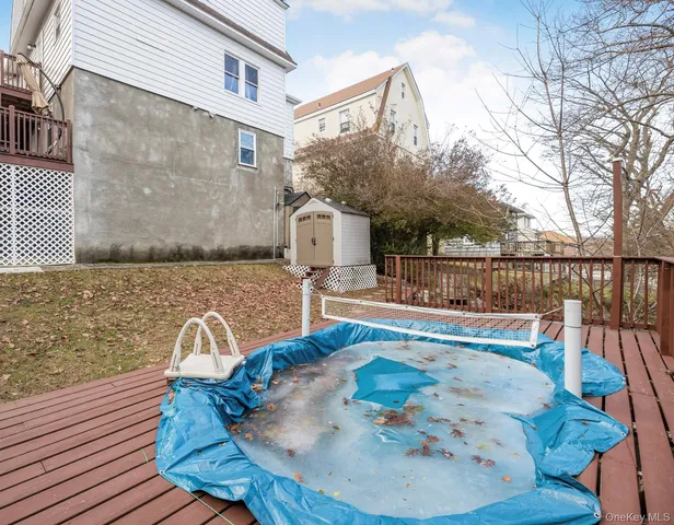 swimming pool view with a seating space