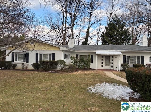 a front view of a house with a yard and porch