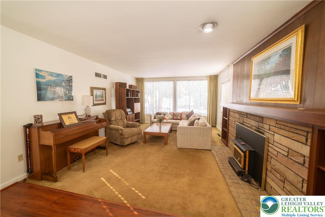 627 North Main Street Allentown, PA 18104 - Photo 12 of 24 a living room with furniture and a fireplace