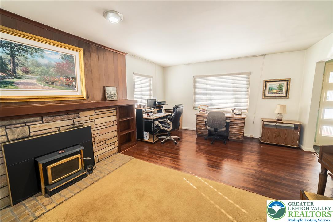 627 North Main Street Allentown, PA 18104 - Photo 13 of 24 a living room with furniture a fireplace and wooden floor