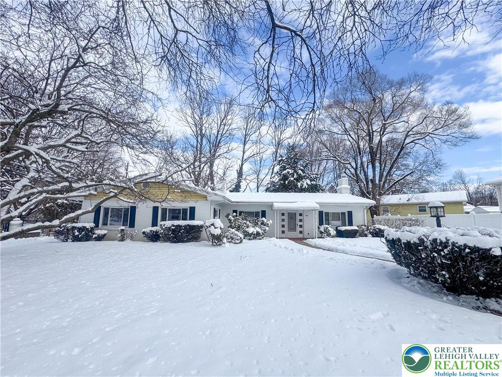 627 North Main Street Allentown, PA 18104 - Photo 2 of 24 a view of a white house with a yard covered in snow
