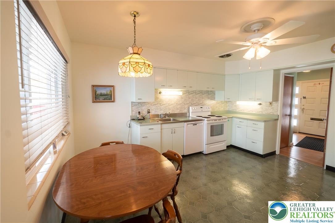 627 North Main Street Allentown, PA 18104 - Photo 7 of 24 a kitchen with stainless steel appliances granite countertop a sink cabinets a stove and a window