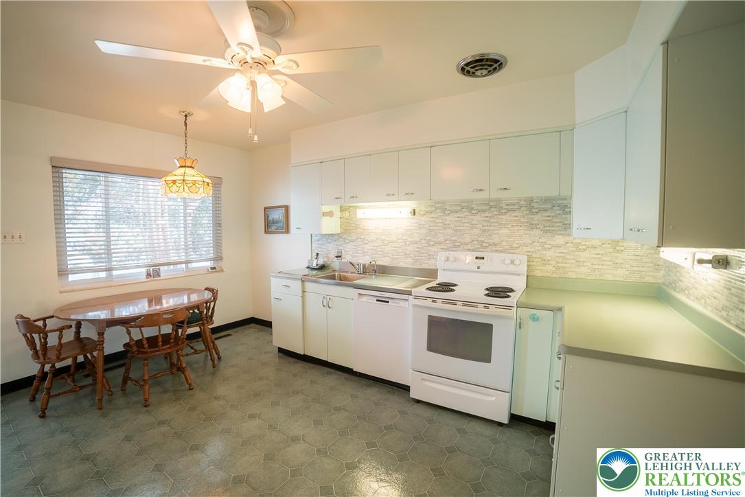 627 North Main Street Allentown, PA 18104 - Photo 8 of 24 a kitchen that has a lot of cabinets in it and appliances