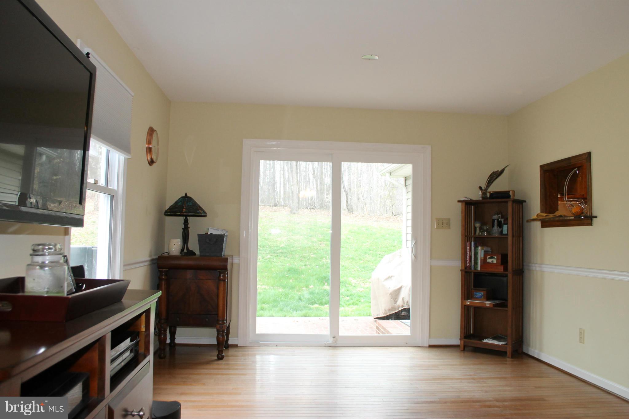 9592 Jamesons Mill Road Culpeper, VA 22701 - Photo 14 of 30 a view of a livingroom with wooden floor and a window