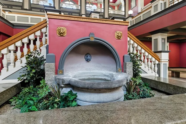 a view of a room with gym equipment and floor to ceiling window