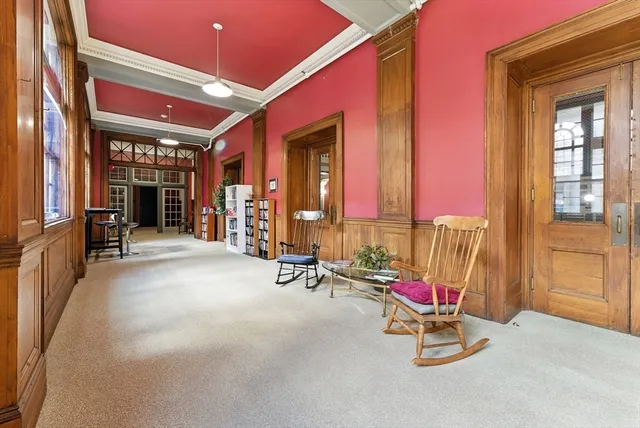 a view of a livingroom with furniture and an entrance