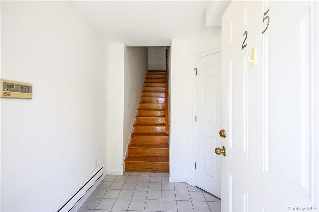 599 Midland Avenue, Unit 25 Rye, NY 10580 - Photo 3 of 25 Entry foyer and stairs to second floor