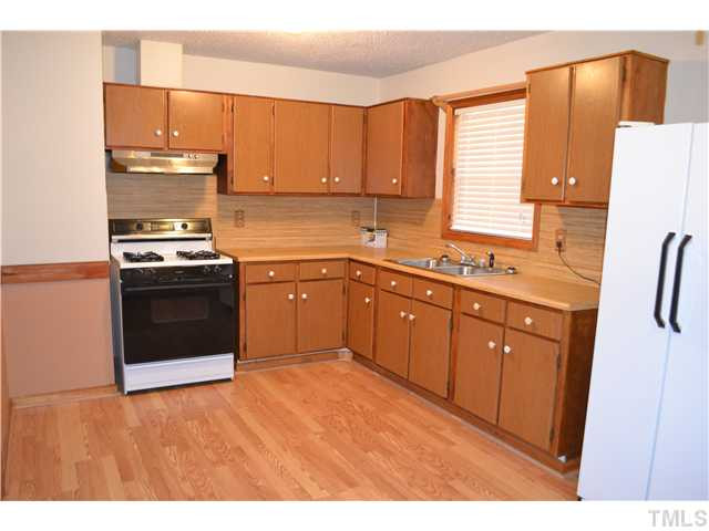 505 Solar Drive Raleigh, NC 27610 - Photo 4 of 16 Very Roomy Kitchen with lots of cabinets and dining area. Stove and refrigerator will stay with house! Kitchen