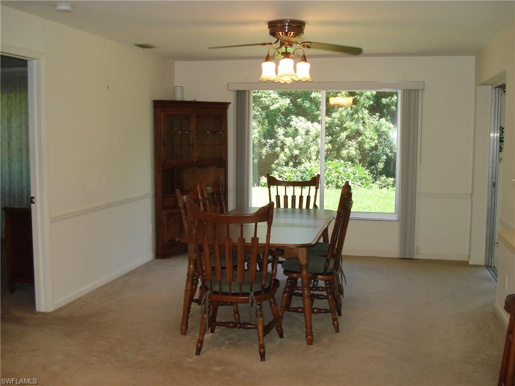18057 Laurel Valley Road Fort Myers, FL 33967 - Photo 12 of 25 a view of a dining room with furniture window and outside view