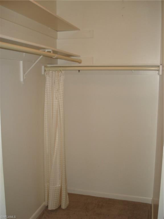 18057 Laurel Valley Road Fort Myers, FL 33967 - Photo 18 of 25 a view of a room with wooden shelves