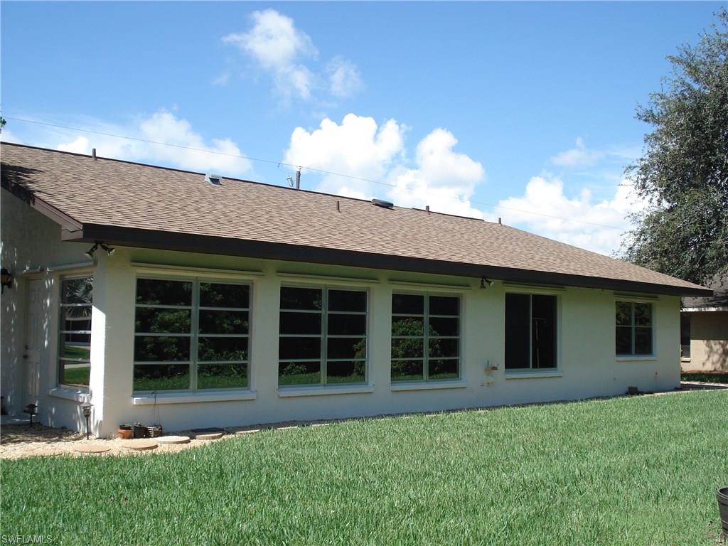 18057 Laurel Valley Road Fort Myers, FL 33967 - Photo 2 of 25 front view of a house with a yard