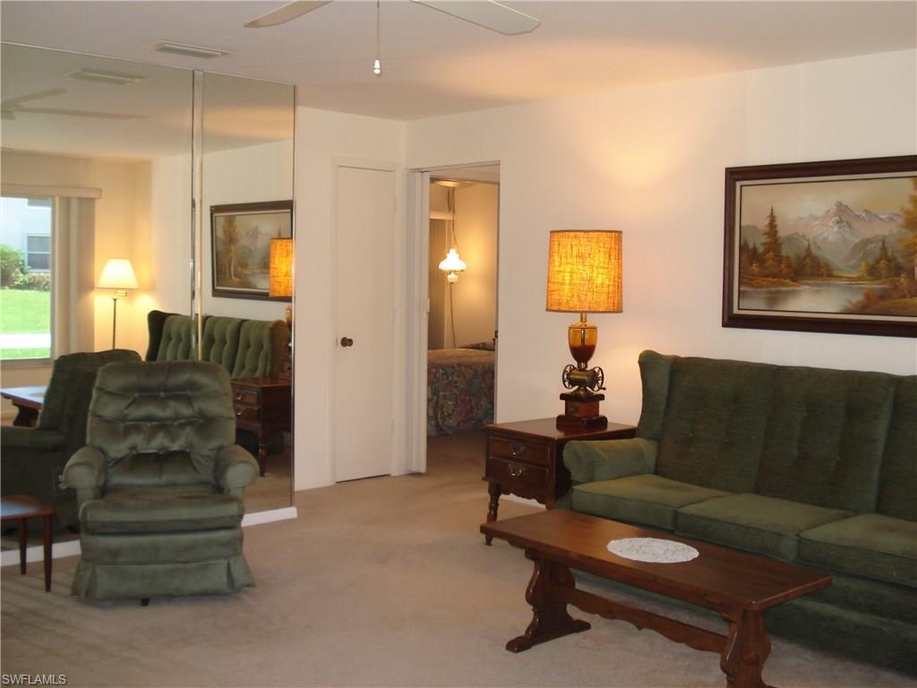 18057 Laurel Valley Road Fort Myers, FL 33967 - Photo 9 of 25 a living room with furniture and a painting