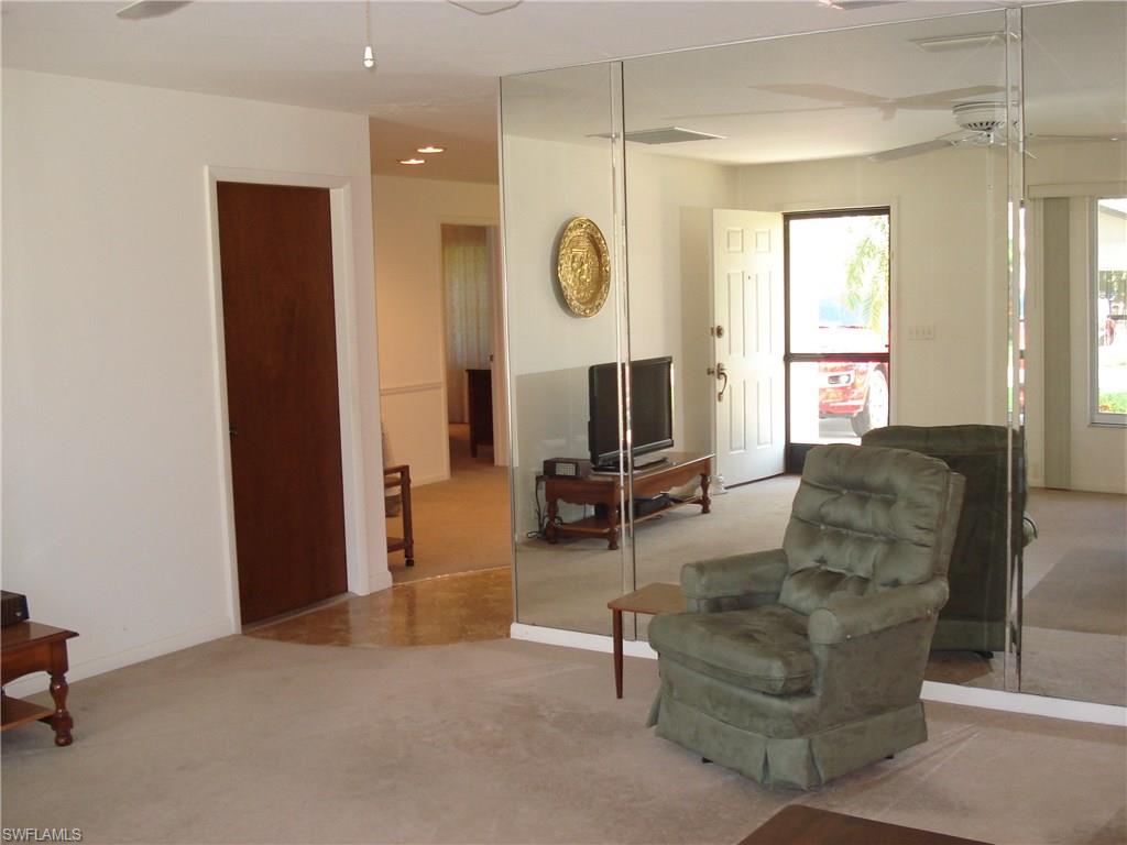 18057 Laurel Valley Road Fort Myers, FL 33967 - Photo 10 of 25 a living room with furniture and a large window