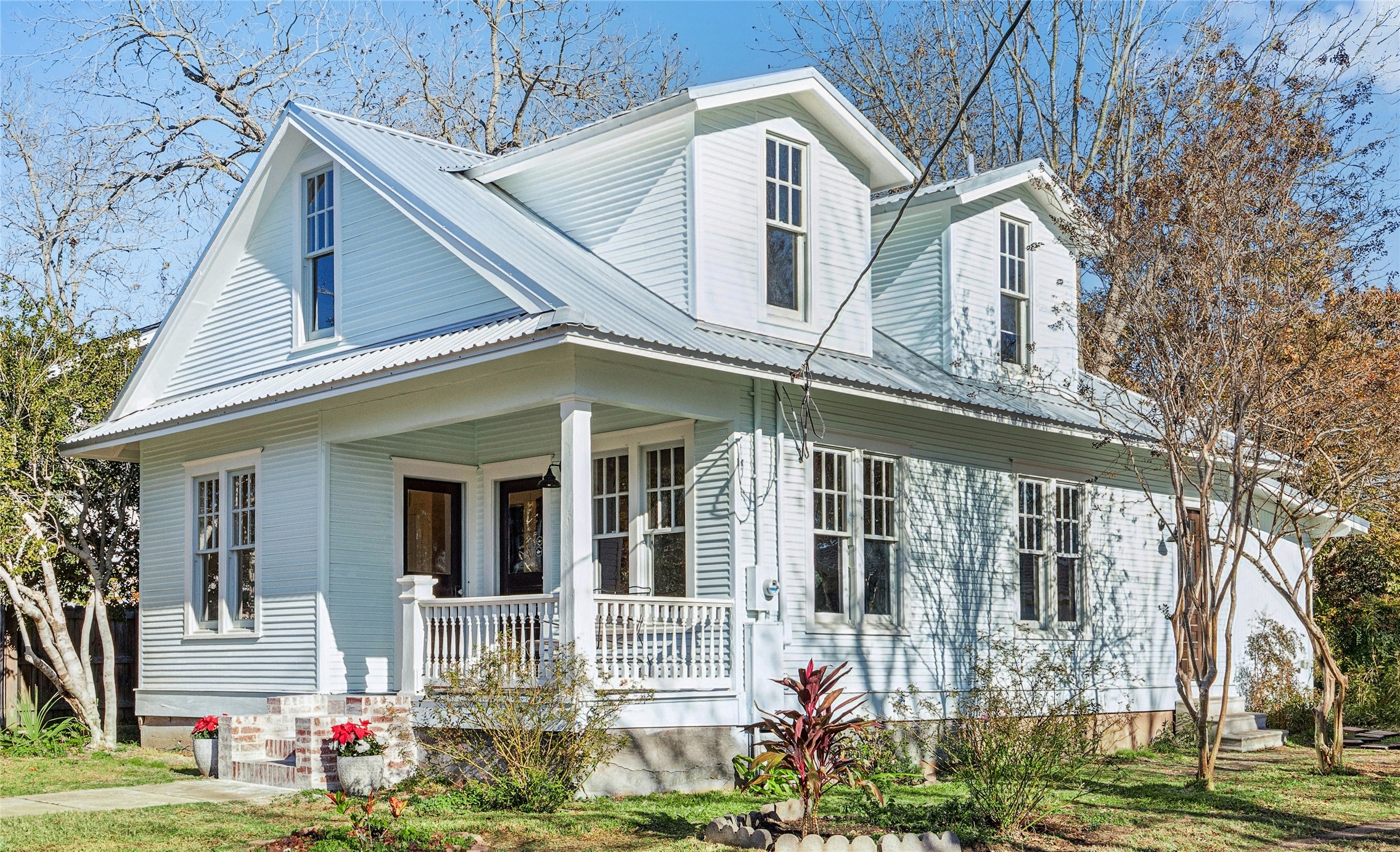 a front view of a house with garden