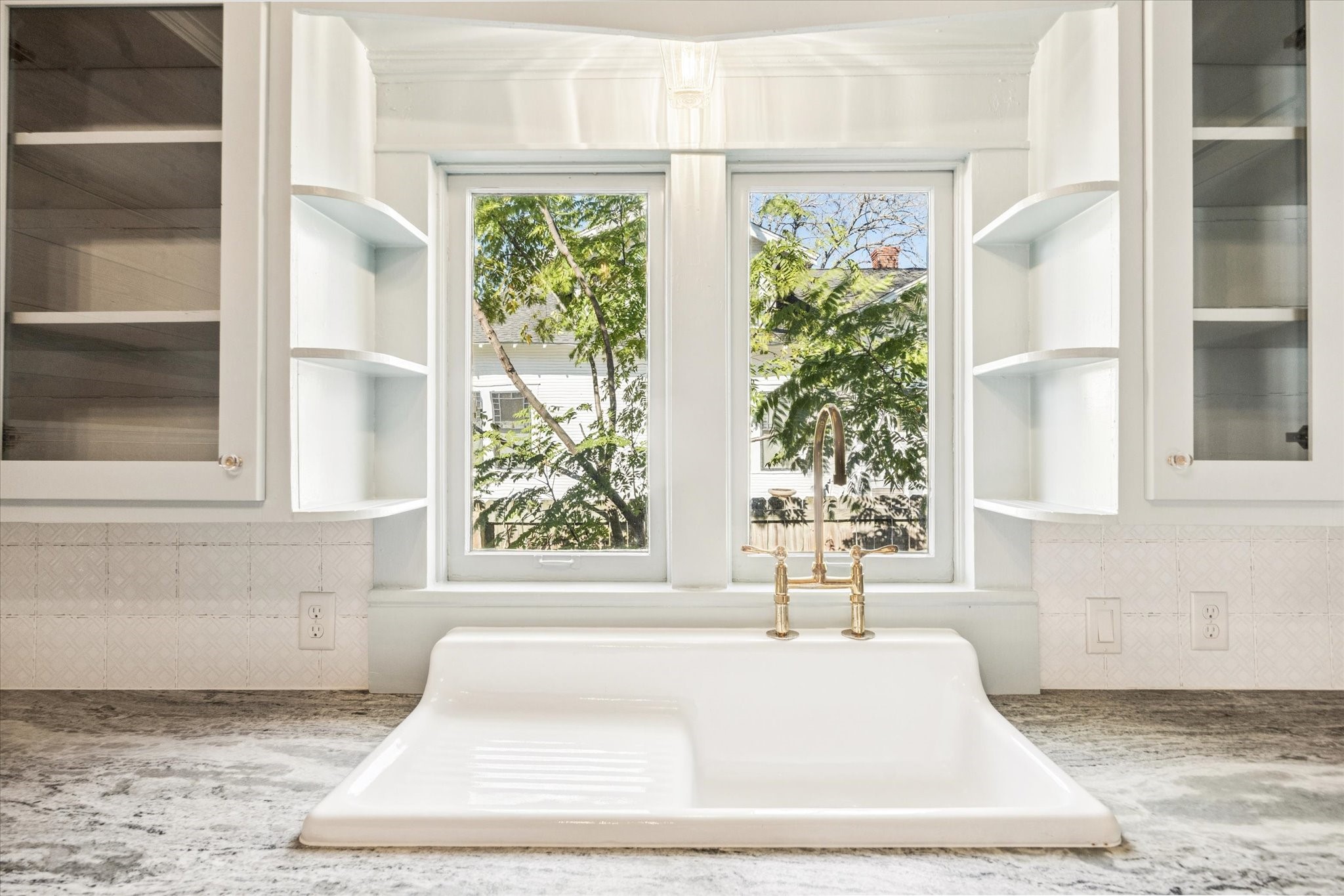 208 North Rusk Street Fayetteville, TX 78940 - Photo 6 of 17 a white bath tub sitting in a bathroom next to a window