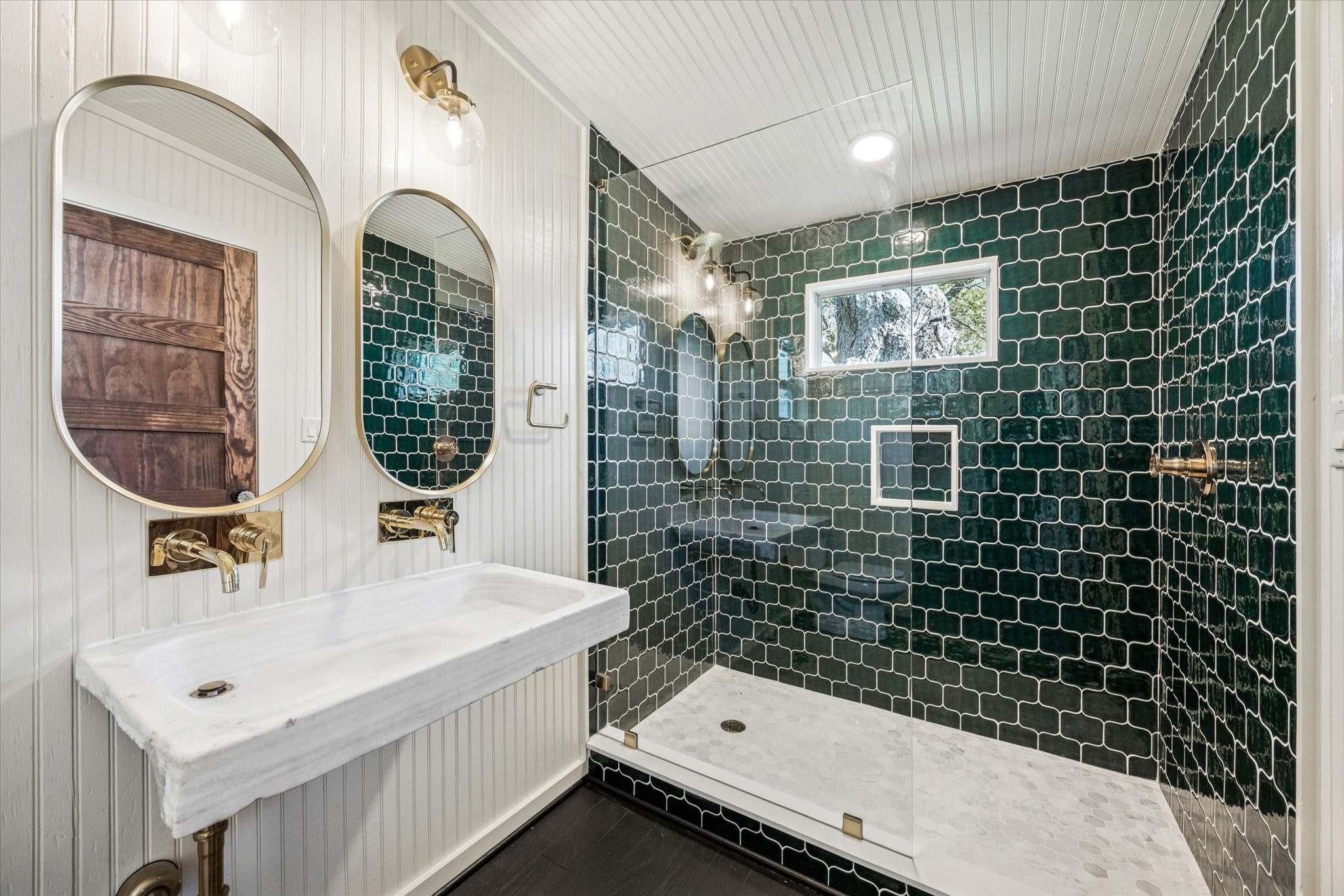 208 North Rusk Street Fayetteville, TX 78940 - Photo 7 of 17 a bathroom with a sink a mirror and shower