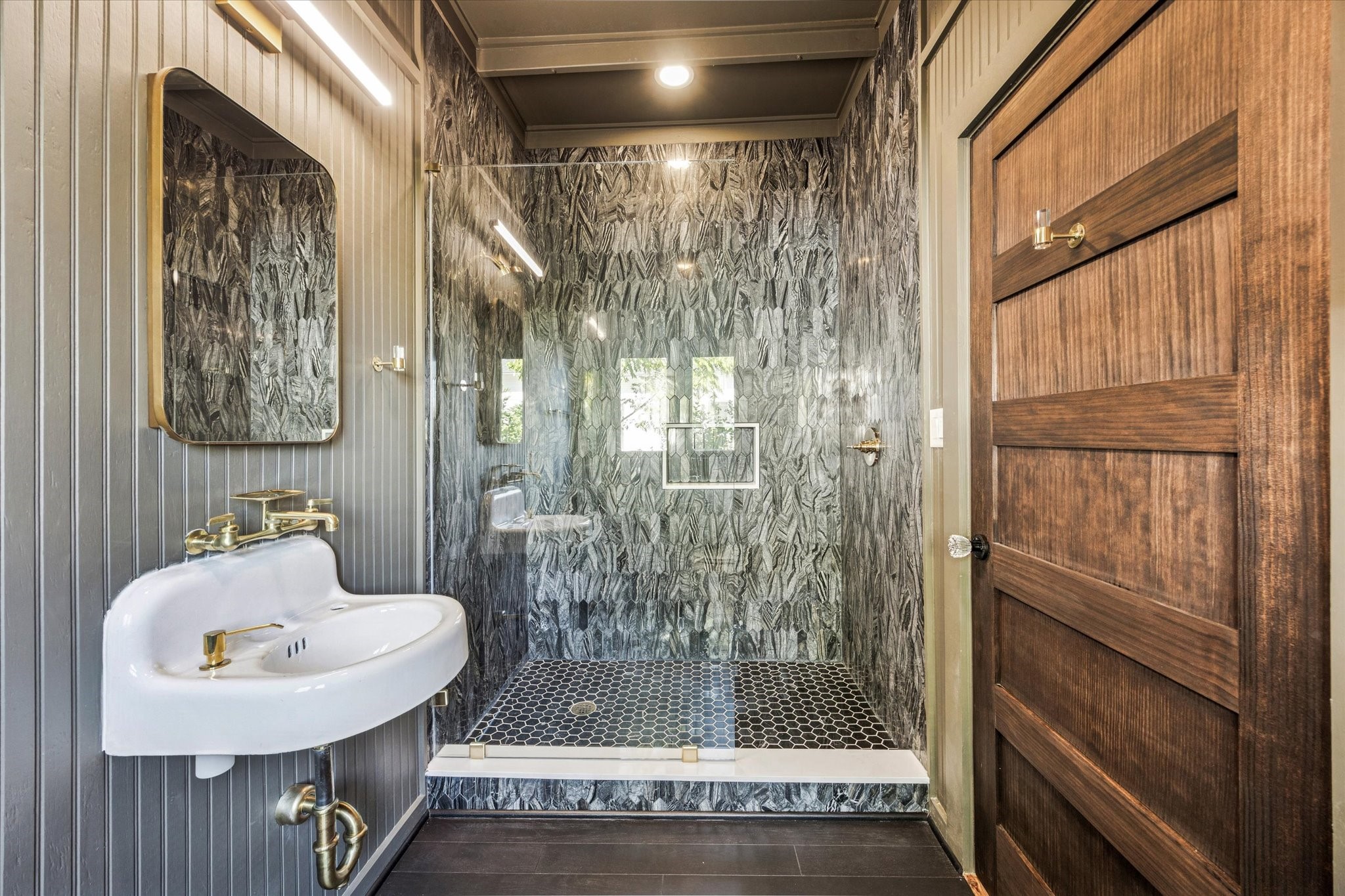 208 North Rusk Street Fayetteville, TX 78940 - Photo 10 of 17 a bathroom with a shower and mirror