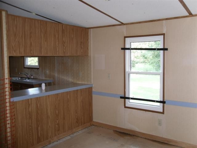 328 Seed Tick Road Sweetwater, TN 37874 - Photo 6 of 12 a kitchen with a sink a window and cabinets