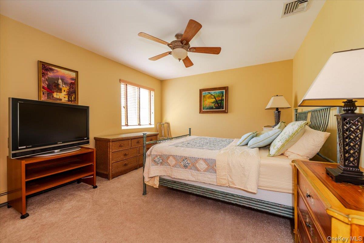 40 East Penn Street Long Beach, NY 11561 - Photo 24 of 41 a bedroom with a bed and a flat screen tv