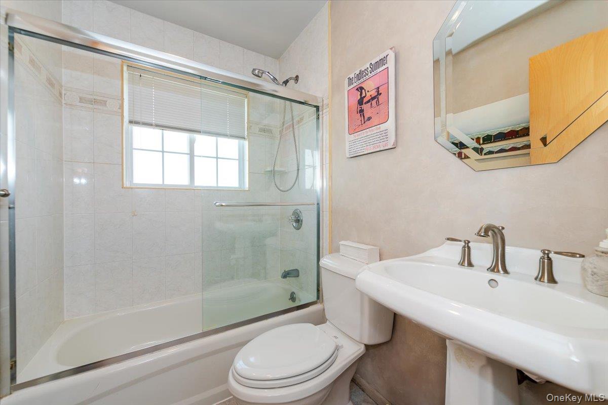 40 East Penn Street Long Beach, NY 11561 - Photo 27 of 41 a bathroom with a sink toilet and shower