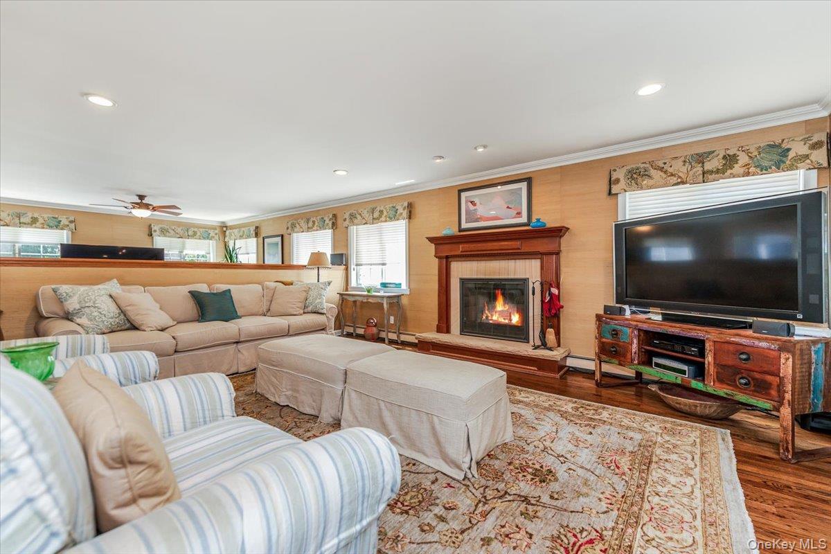40 East Penn Street Long Beach, NY 11561 - Photo 5 of 41 a living room with furniture and a flat screen tv