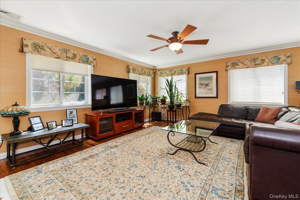 40 East Penn Street Long Beach, NY 11561 - Photo 7 of 41 a living room with furniture and a flat screen tv