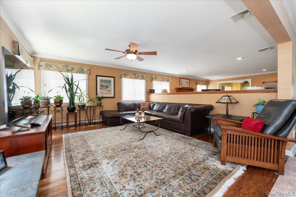 40 East Penn Street Long Beach, NY 11561 - Photo 9 of 41 a living room with furniture and wooden floor
