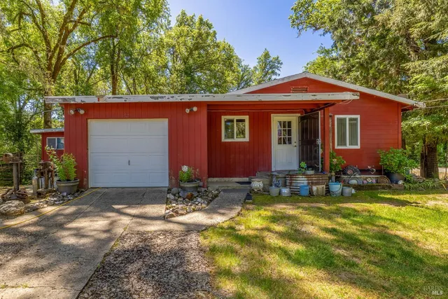 a view of house with yard