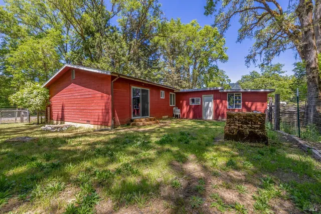 a front view of house with yard and seating area