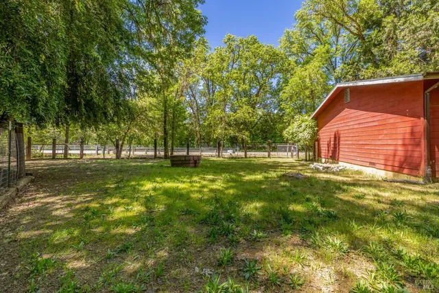 a view of outdoor space with deck and trees