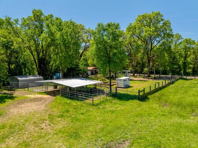 a view of a swimming pool with a table and chairs