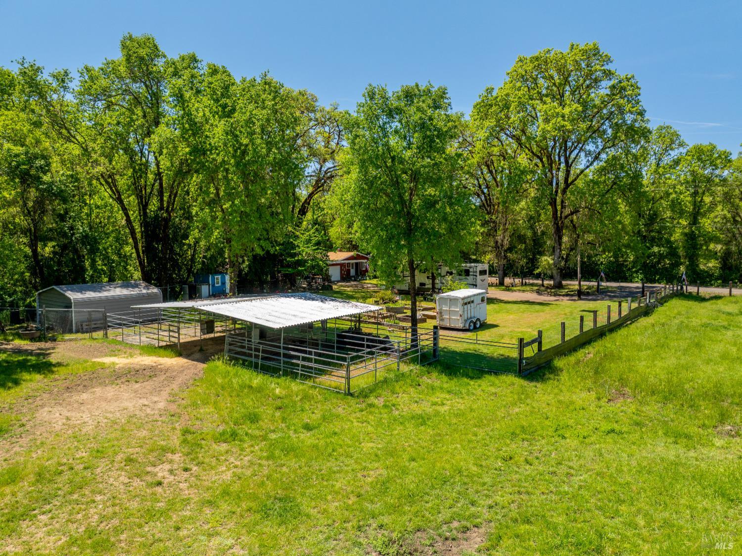3901 Canyon Road Willits, CA 95490 - Photo 21 of 35 a view of a swimming pool with a table and chairs
